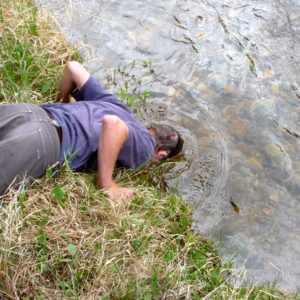 Tony Vorster dunks his head in St. Louis Creek at the Fraser Experimental Forest