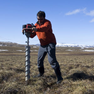 Matt Wallenstein making soil cores in the arctic