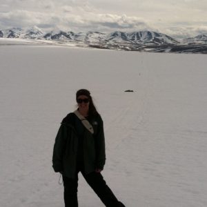 Megan Machmuller surveying snow-covered field sites, Alaska