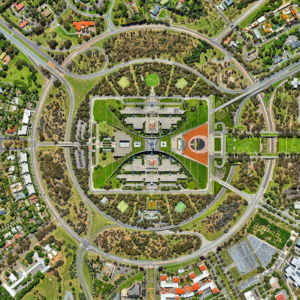 An aerial view of a city with heterogenous land cover (trees, buildings, streets, parks)